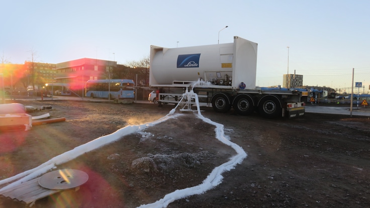A truck-mounted Linde tank supplies liquid nitrogen via frost-covered pipes at a ground freezing project site.