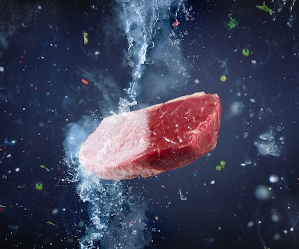 Cryogenic liquid freezing a red meat cut