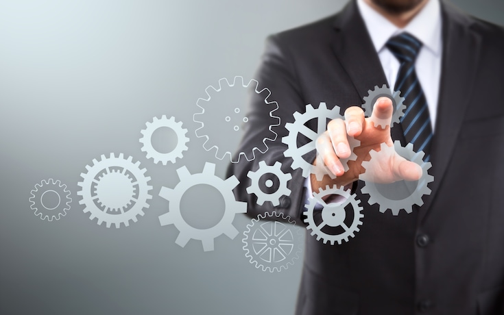 Businessman activate and writing growth process with gears