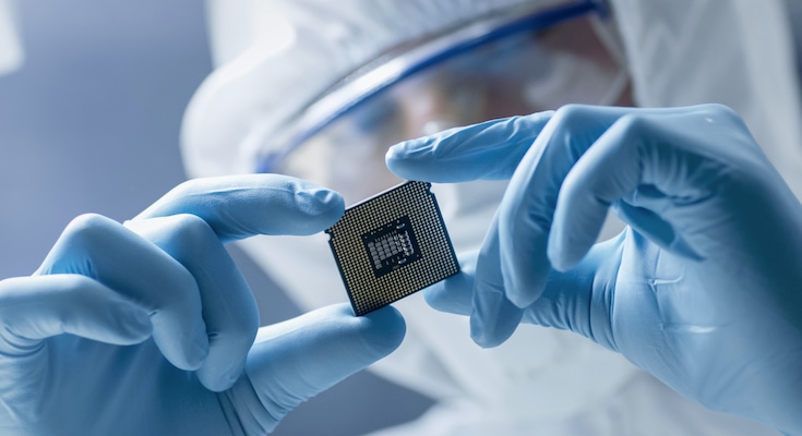 Scientist examining microchip