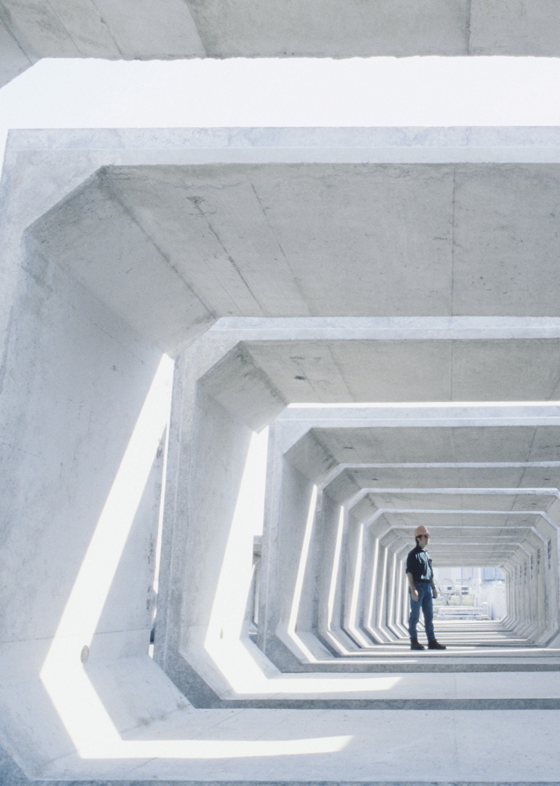 Worker inspecting concrete tunnel section