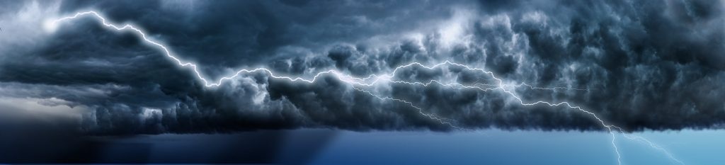 Lightning across a dark blue sky