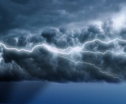 Lightning across a dark blue sky