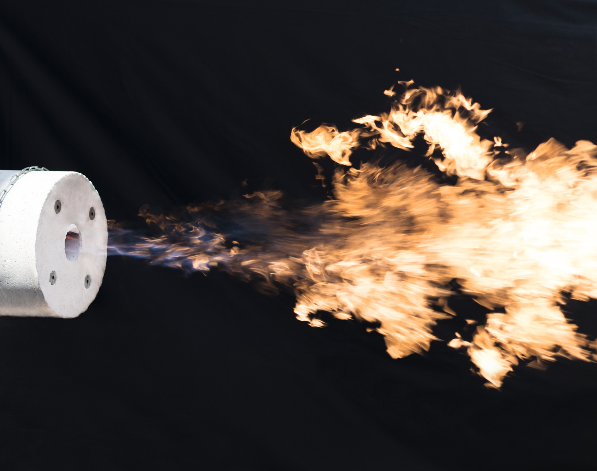 Oxygen enhanced burner with flame