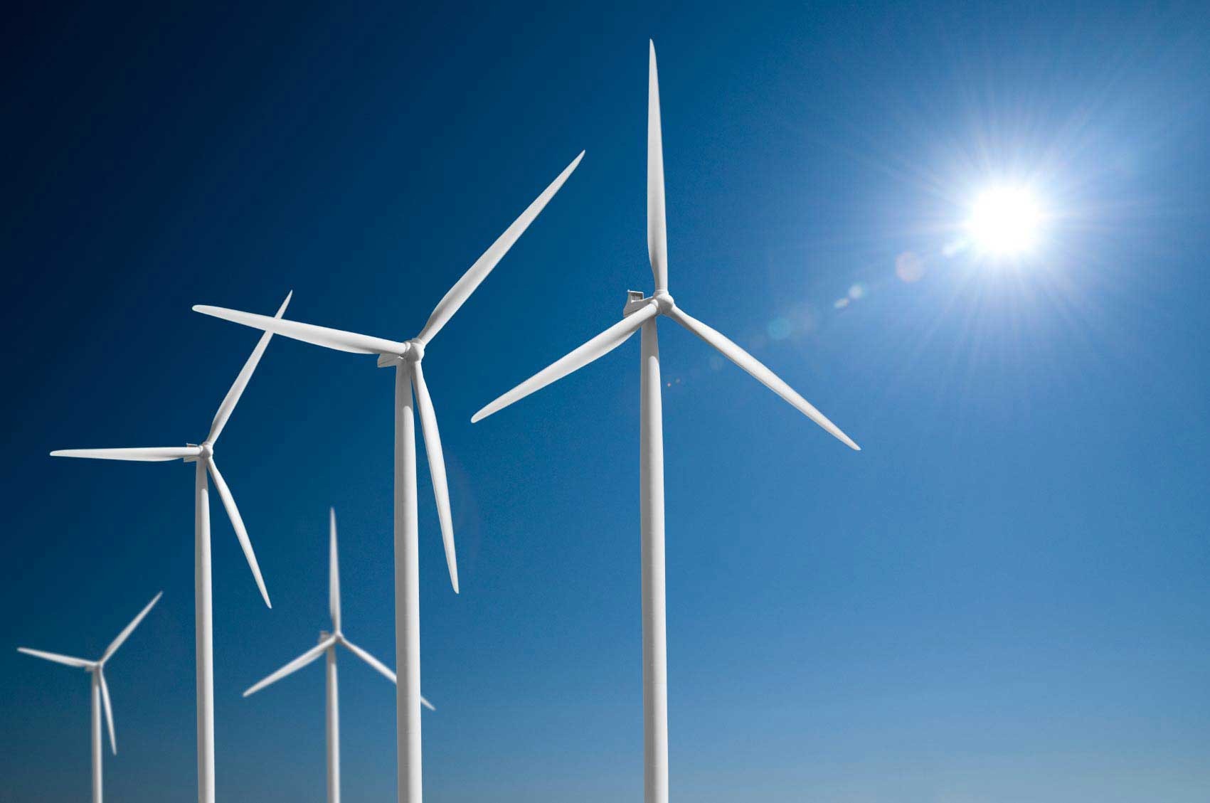 Wind turbines and a bright sun for alternative energy