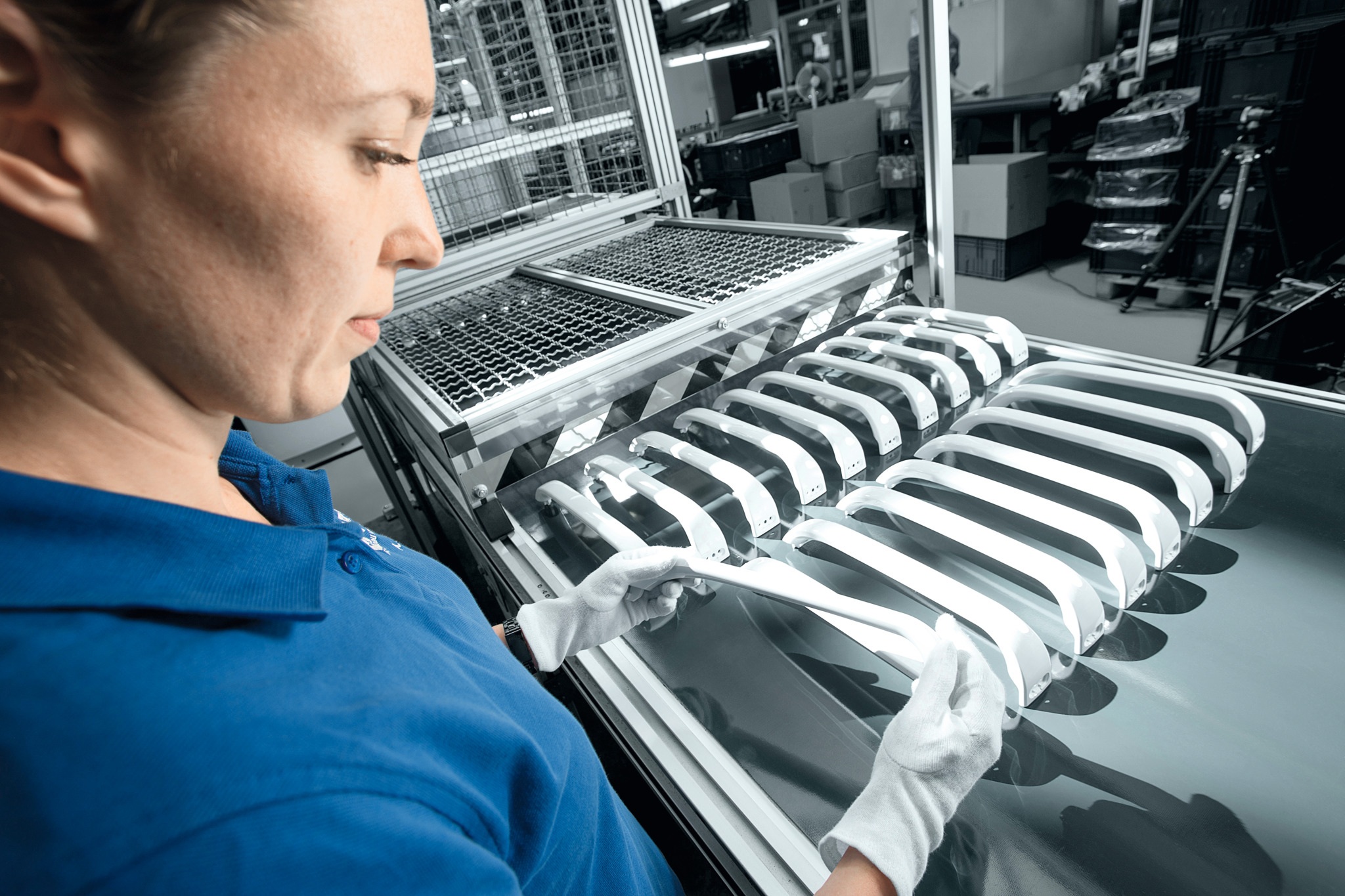 Worker producing plastic handles