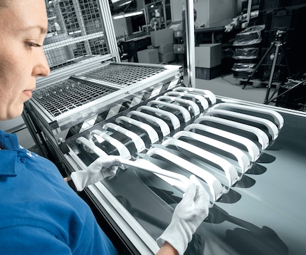 Worker producing plastic handles