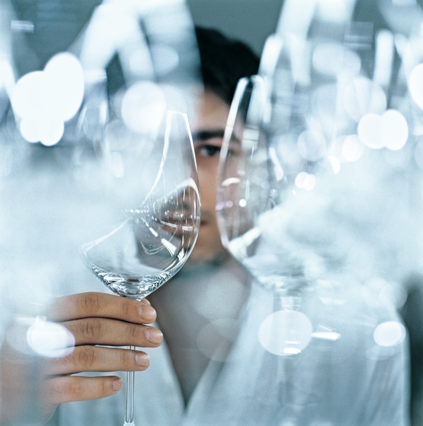 Man looking through wine glass