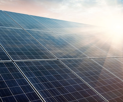 Solar power plant at sunset