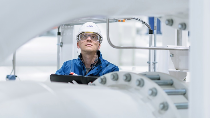 Engineer in front of VITRON VPSA plant in Äänekoski, Finland