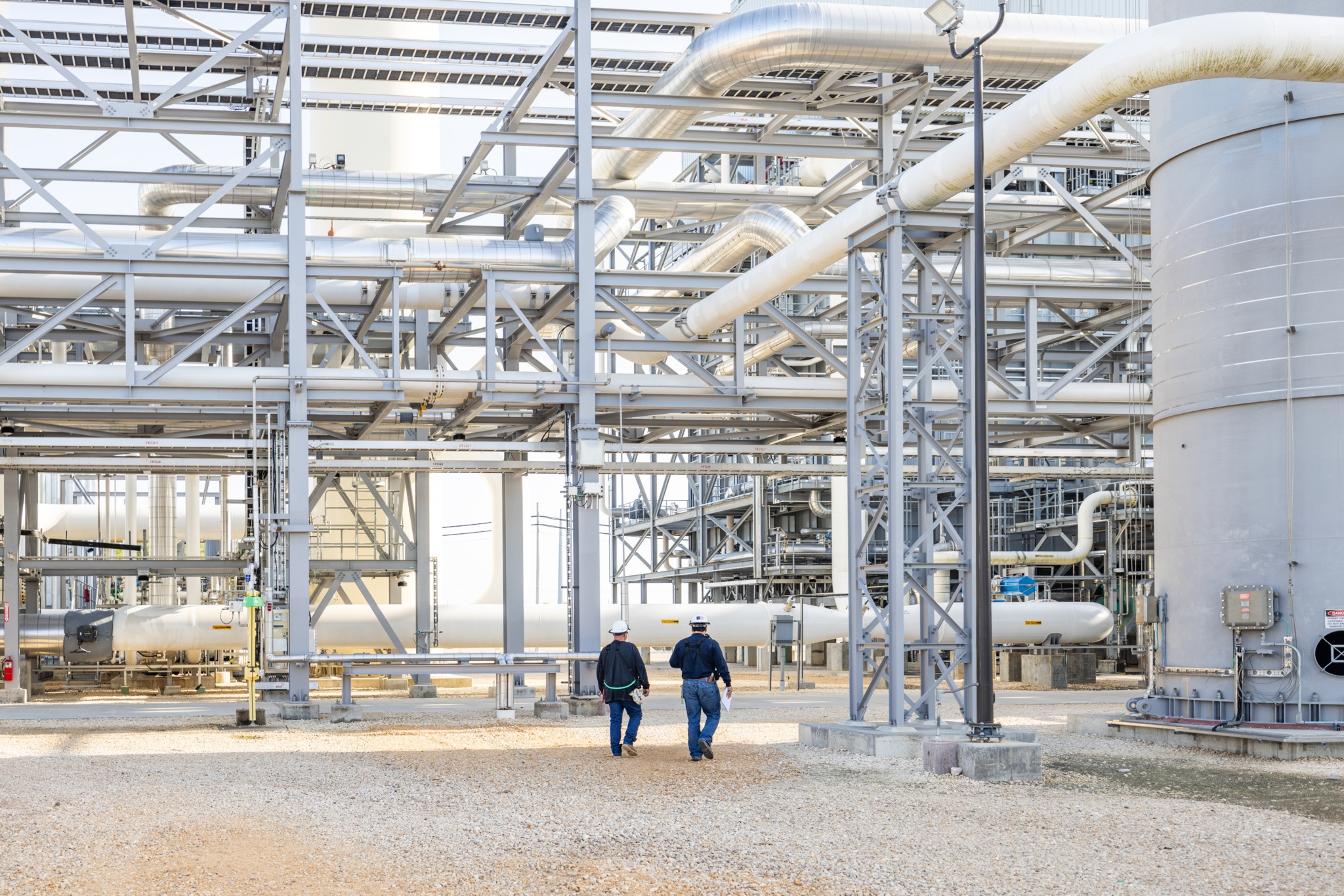 Engineers walking across the plant
