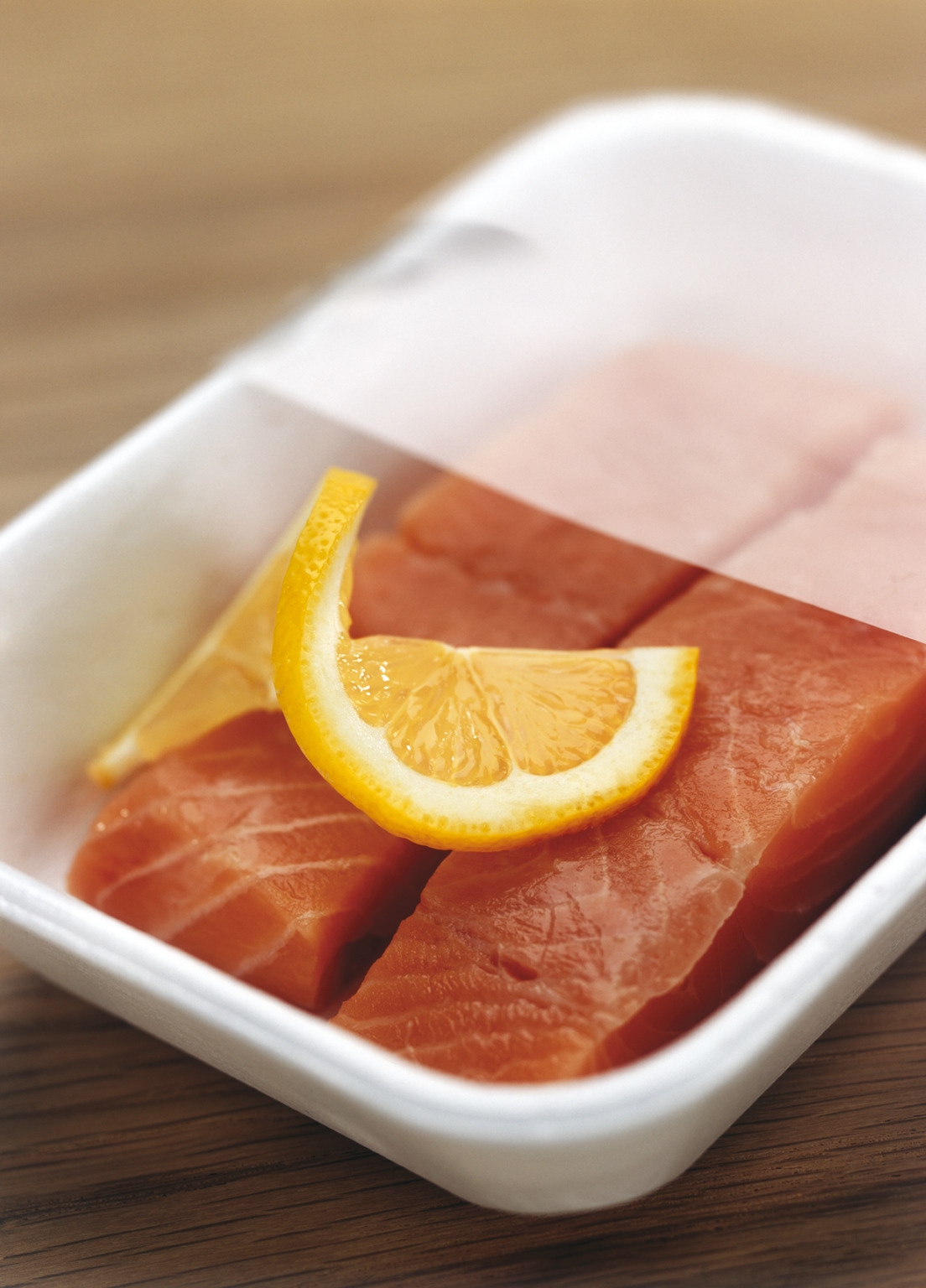 Salmon with modified atmosphere packaging film pulled back