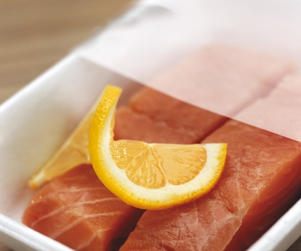 Salmon with modified atmosphere packaging film pulled back