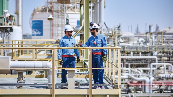 Two workers at the Hydrogen and Synthesis gas plant, Al Jubail, Saudi Arabia