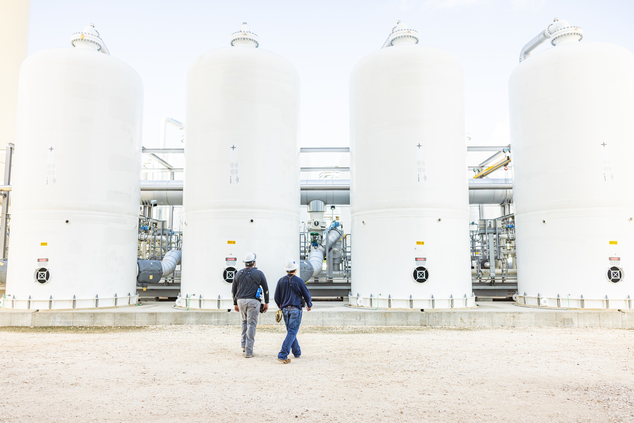 Engineers walking across the plant