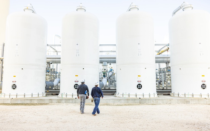 Engineers walking across the plant