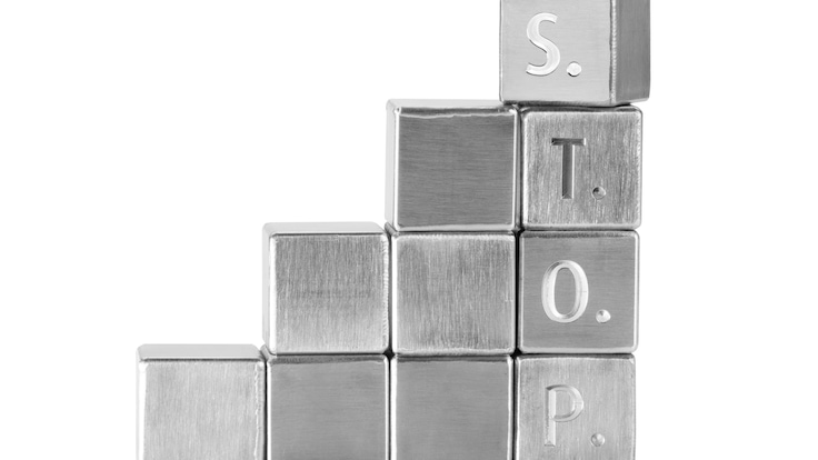 Metallic, welded cubes visualize the S.T.O.P hierarchy of controls recommended for OSH in welding.