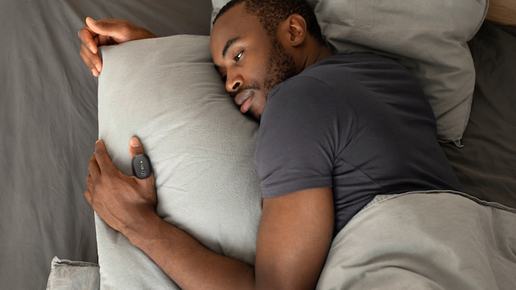 Man sleeping wearing SleepImage adult ring